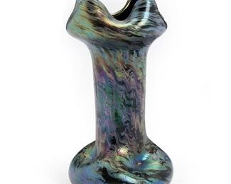 242
A Loetz Pinched Four-Corner Style Iridescent Glass Vase
Late 19th/early-20th Century; Bohemia (Czech Republic)
The Art Nouveau purple, blue, and black vase with ribbon-style rim
7" H x 3.625" Dia.
Estimate: $500 - $700