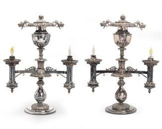 252
A Pair Of Silverplated Lamps
Late 19th/early-20th Century
Each two-light electrified lamp with an acorn-finial urn-shaped top and lion decoration, possibly originally gas, 2 pieces
Each approximately: 21.5" H x 16" W x 7" D
Estimate: $1,200 - $1,800