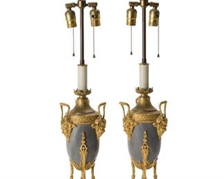 255
A Pair Of François Barbedienne Table Lamps
Fourth-quarter 19th Century
Stamped: F. Barbedienne
Each two-light grey marble urn-shaped lamp with bronze satyr mount, foliate and geometric motif, and double hooved feet, each topped with a flame-shaped bronze finial, 2 pieces
Each: 30.375" H x 6.25" Dia.
Estimate: $4,000 - $6,000