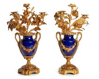 273
A Pair Of French Gilt Bronze Candlelabra
Late-19th/early-20th Century
Each four-light candelabra with floral and leaf arms extending from a cobalt blue urn body on a bronze pedestal, 2 pieces
17.25" H x 10.5" W x 8" D
Estimate: $1,000 - $2,000