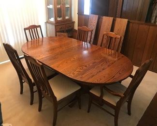 Amish Dining room table with four leafs and six chairs.