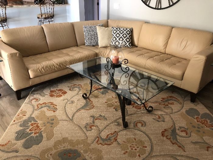 BEAUTIFUL LEATHER SECTIONAL,  AREA RUG,  COFFEE TABLE