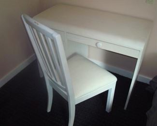 White vintage student desk and chair.