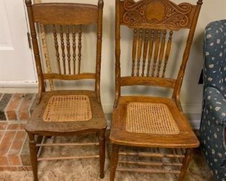 #47	(2) Oak Odd Dining Chairs - cane seat   $25 each	 $50.00 	 call 256-603-4198 
