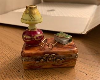 #121	Limoges trinket box suitcase,lamp and book	 $25.00 	 call 256-603-4198 
