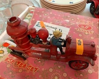 #147	KR	Iron red fire truck with yellow hat  man 	 $20.00 	 call 256-603-4198 
