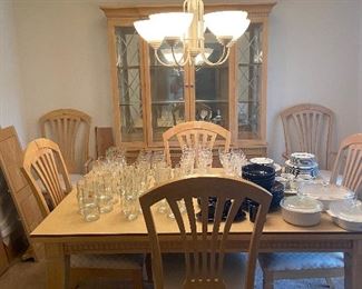 Six chair dining room set with china cabinet. Has two leafs and pads for protection. 