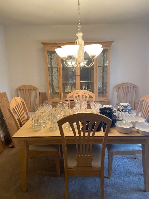 Six chair dining room set with china cabinet. Has two leafs and pads for protection. 