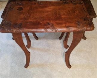 This set is made of teak or monkey pod. They are carved. End table with middle table.