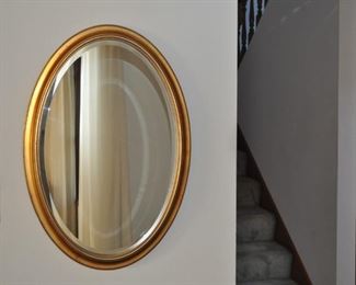 Heavy gold framed oval mirror 32” x 22”