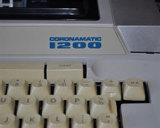 Administrator Alma mid-century walnut desk 60” x 30” and 28.5” tall (out of High Point, North Carolina in the 1960’s. The company was bought out by Heworth in the 1990s. The patent on this design was filed in 1964.  It has a laminate top which was probably used to ensure durability. Eames era “design” of the legs.), 
Administrator Alma mid-century walnut return/credenza 77” x 18” and 28.5” high, Corona Coronamatic 1200 electric typewriter with case, MacIntosh SE vintage computer keyboard and manuals, MacIntosh vintage printer