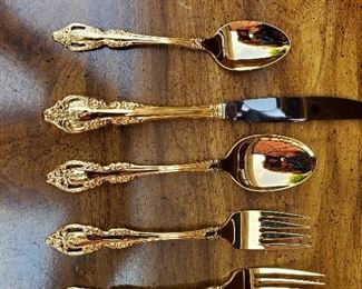 brand new gold tone onidea flatware with serving pieces!!!