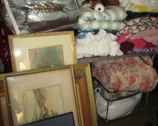 bedding & stacks of pictures 