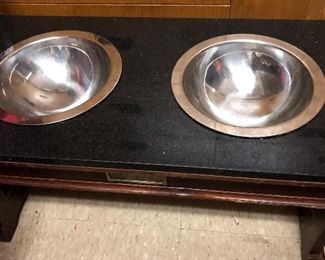 One of two marble and wood elevated dog food/water station with removable stainless bowls. 13" x 25 1/2" x 13" h $80.