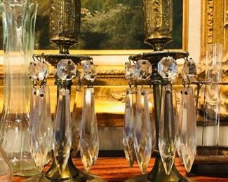 Pair of Antique brass candle holders with glass prisms.