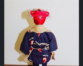 Door of Hope Doll- carved pear wood, cloth body, handmade and dressed in authentic Chinese clothing.  Made in Chinese mission (Circa 1905-1910) 6-1/2”Girl.  Fringed head dress, embroidered shoes, carved pear wood head and hands.