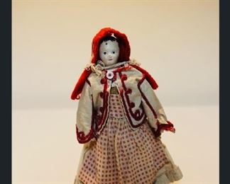 6-1/4” paper mache lady doll in red hood.  Kid arms, cloth body- (VERY EARLY) Purchased in Paris, France antique shop.  Doll dates from early 1800’s.