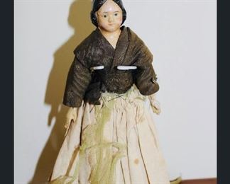 8” Milliner’s Model Paper -mache and wood.  Brown blouse Ivory skirt.  Purchased from Richard Wright.  
Mid 1800’s