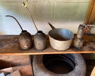 Vintage oil cans and antique pot