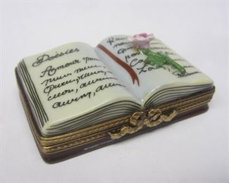 Peint Main Limoge France porcelain trinket box with hinged lid. In the form of a book.  Has La Gloriette stamp on base. 2 3/8" by 1 1/2". 