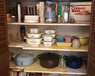 Pantry full of kitchen items and cook books
