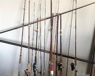 Several fishing poles, rods and reels