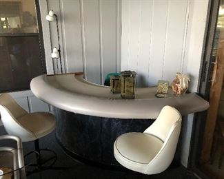 Curved bar with two bar stools