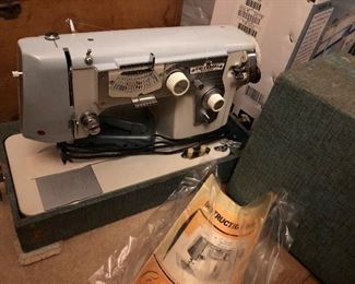 Universal Sewing Machine.  Centennial Series.  Comes with case