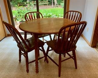 $200.00......Small Oak Drop Leaf Kitchen Table and 4 Chairs, 41" diameter drop leaves on each side (J472)