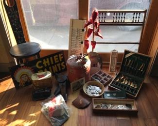 Coins, pottery, Chief Paints sign, gemstones, vintage gas can, leather gun holders, collectibles, vintage thermometer. 