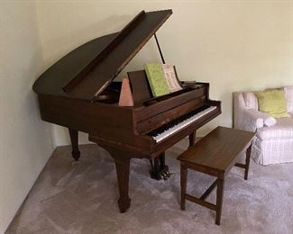 7. Nice baby Grand piano in a wood grain finish.  More Details to come about maker and serial number.  All keys work and I see no chips on the ivory or damage.  Was maintained well until 2 years ago.  $500