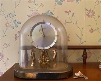 12. Brass winding  clock.  Works intermittently.  Not cleaned.  $95