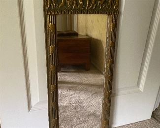 18. ornate old mirror, slight and antique. about 24" by 10" $35