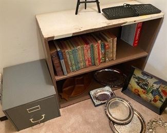 24. Shelf with books and one metal file cabinet (trays sold separately) $25