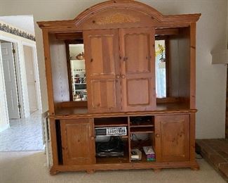 43. Nice Mirror backed entertainment center with cutaways inside toe fit a large flatscreen tv (probably up to 50")  Door slide (contents not included) $95