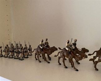 53. Set of old lead metal (probably) BRITAINS arab soldiers and camels. $225 all on this shelf. 