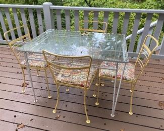 64. Nice petite glass table and wrought iron in yellow  retro mid-century $150. No chips