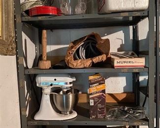 76. Left grey shelf with planter on floor. NOT RIGHT SHELF.  
This includes kitchenaid mixer, large clear bird feeder, bud cooler and old fan motor $95