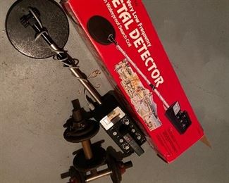 78. 2 dumbbells and an untested metal detector $35