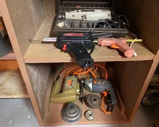 83. Two shelves of drills and pieces and parts $20