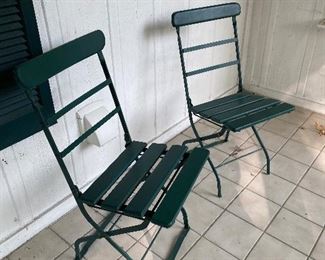 97. Three old folding wood and metal chairs $35