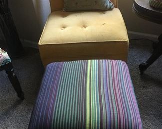 Yellow tufted slipper chair and antique bench