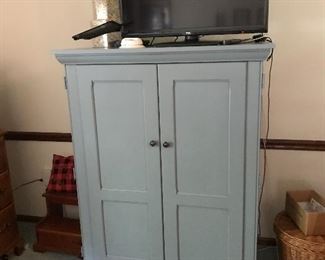 Painted blue TV cabinet