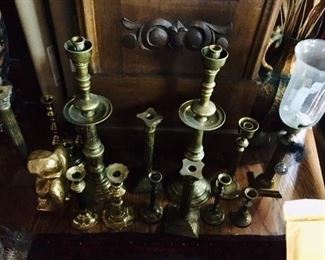 Collection of brass candle holders--will be priced individually and pairs. 