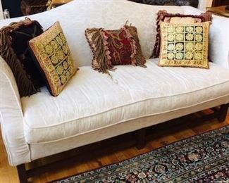 Very comfortable white sofa...the carpet is not included in this sale. 