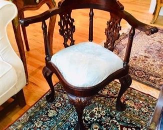 One of a pair of corner chairs...this rug is not included in the sale.