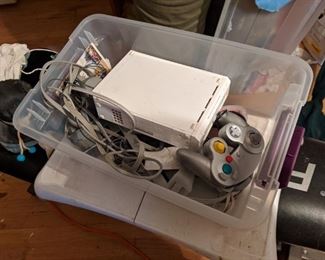 Wii with controllers, fit board, and several games