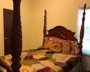 Queen sized four poster bed, brand new mattress set included. Carved detail, elegant and solid. Linens can be included if you want.
