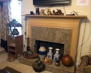 Various decorative items, including fireplace tools. This Tiffany lamp shown on the shelf unit is sold. Sorry!