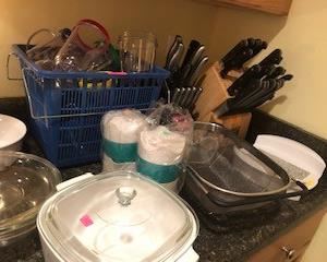 two knife sets (one missing 3 knives), juicers, Ninja blender cups, Corningware microwave trivet